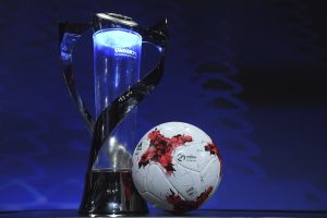 The UEFA Under-21 Championship trophy and adidas official match ball on the stage ahead of the UEFA European Under-21 Championship Final Tournament Draw